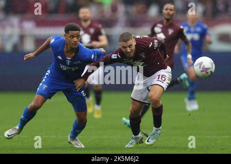 Turin, Italy. 9th Oct, 2022. Koni De Winter of Empoli FC tussles with Nikola Vlasic of Torino FC during the Serie A match at Stadio Grande Torino, Turin. Picture credit should read: Jonathan Moscrop/Sportimage Credit: Sportimage/Alamy Live News Stock Photo