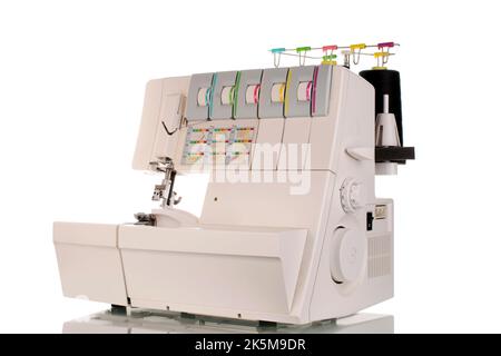 One electric sewing overlock, macro, isolated on white background. Stock Photo