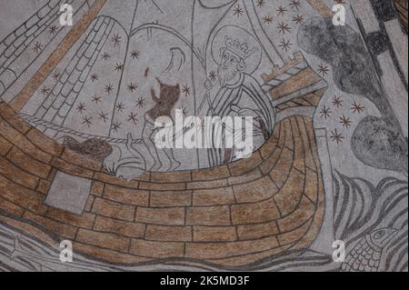 St. Olaf stands at the steering oar on a medieval ship, an ancient fresco in Kirke Hyllinge church, Denmark, October 4, 2022 Stock Photo