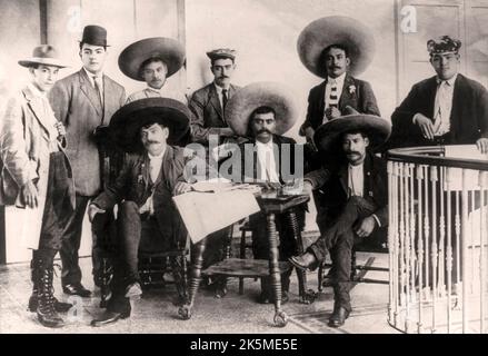 Emiliano Zapata Salazar (1879-1919), leader of the Mexican Revolution (1910-1920). From left to right: Tirso Espinosa, Gildardo Magaña, M. Mejía, Abram Martínez, Jesús Jauregui and Rodolfo Magaña; seated: Eufemio Zapata (Emiliano's brother), Emiliano Zapata and Próculo Capistrán. They are at Hotel Coliseo, Mexico City on June 24, 1911 Stock Photo