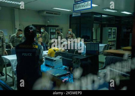 October 9, 2022, Uthai Sawan, Nong Bua Lamphu, Thailand: CNN reporter Anna Coren and cameraman Daniel Hodge sit as they talk to Thai government officials in an administrative building near the site of the day care center massacre where they illegally trespassed to film a news segment 2 days earlier. (Credit Image: © Adryel Talamantes/ZUMA Press Wire) Credit: ZUMA Press, Inc./Alamy Live News Stock Photo