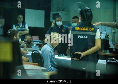 October 9, 2022, Uthai Sawan, Nong Bua Lamphu, Thailand: CNN reporter Anna Coren and cameraman Daniel Hodge sit as they talk to Thai government officials in an administrative building near the site of the day care center massacre where they illegally trespassed to film a news segment 2 days earlier. (Credit Image: © Adryel Talamantes/ZUMA Press Wire) Credit: ZUMA Press, Inc./Alamy Live News Stock Photo