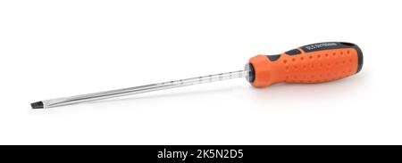 Long screwdriver with red handle isolated on white. Stock Photo