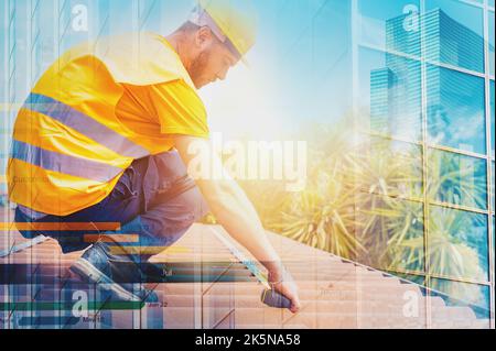 Technical worker takes measurements on the roof of a house Stock Photo