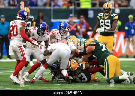 Green Bay Packer's Aaron Jones is tackled during the NFL International match at Tottenham Hotspur Stadium, London. Picture date: Sunday October 9, 2022. Stock Photo