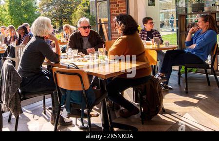 Customer eating outside at the Cafe in Dulwich Picture Gallery in Gallery Rd, Dulwich, South London, UK; designed by Sir John Soane, opened 1817 Stock Photo