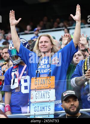 London, UK. 09th Oct, 2022. A New York Giants fan enjoys the football during the match against the Green Bay Packers in the NFL International Series game at White Hart Lane in London on Sunday, October 09, 2022. The Giants beat the Packers 27-22. Photo by Hugo Philpott/UPI Credit: UPI/Alamy Live News Stock Photo