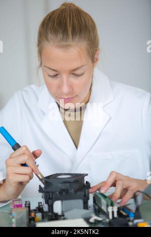 Engineer working with PCB and microchip in the laboratory ...