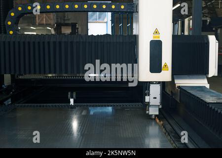 industrial laser cutting machine during metal sheet processing Stock Photo