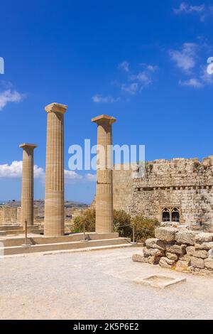 Panoramic view of ruins of ancient city of Lindos on colorful island of Rhodes, Greece. Famous tourist attraction. Ancient temple Greek architecture. High quality photo Stock Photo