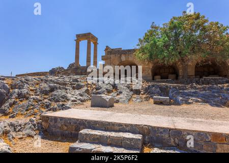 Panoramic view of ruins of ancient city of Lindos on colorful island of Rhodes, Greece. Famous tourist attraction. Ancient temple Greek architecture. High quality photo Stock Photo