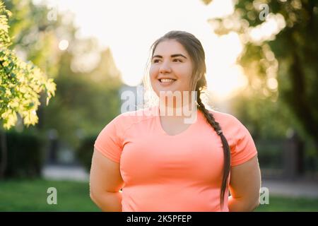obesity people plus size woman smiling outdoors Stock Photo