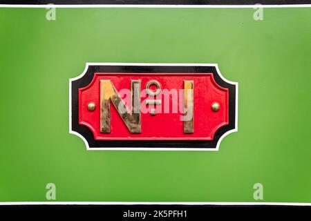 Metal No 1 plate of 0-4-0 Well Tank steam locomotive No 1561 - made by Neilson & Co Ltd in 1870 - in Penrhyn Castle museum, Gwnydd, Wales on 4 October Stock Photo