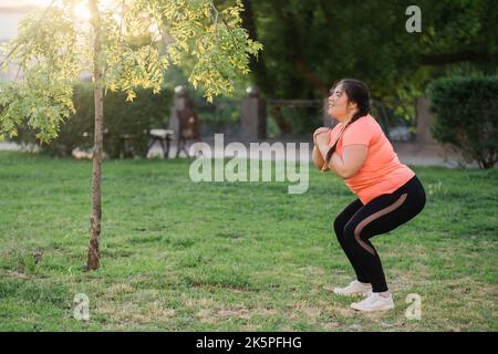 park training obese people overweight woman spring Stock Photo