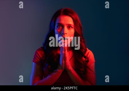 shocked woman color light portrait omg lady red Stock Photo