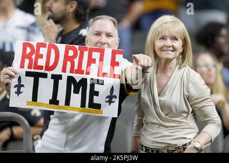 New Orleans, USA. 09th Oct, 2022. A longtime New Orleans Saints fan holds up a sign honoring quarterback Andy Dalton during a National Football League Contest at the Caesars Superdome in New Orleans, Louisiana on Sunday, October 9, 2022. (Photo by Peter G. Forest/Sipa USA) Credit: Sipa USA/Alamy Live News Stock Photo