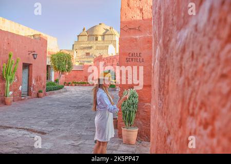 Young Tourists Exploring the Santa Catalina Monastery, Convento de Santa Catalina, Arequipa, Peru Stock Photo