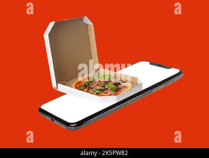 Smartphone and pizza box on red background. Food delivery Stock Photo