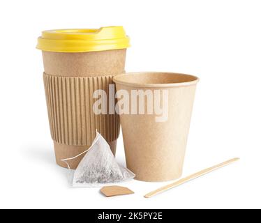 Paper cups and tea bag on white background Stock Photo