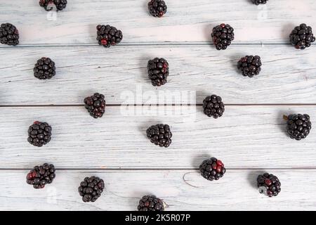 Top view of pattern of blackberries in wooden and rustic background Stock Photo