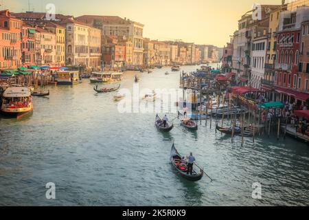 Ornate Gondolas in Grand Canal at golden sunset, Venice, Italy Stock Photo