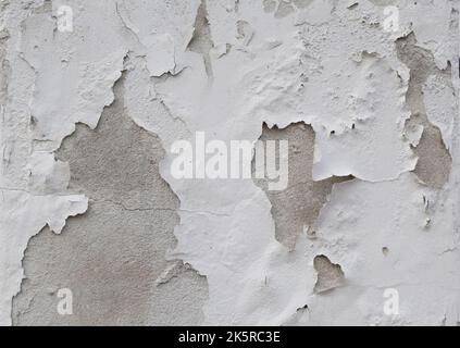Background of peeling white paint on an old wall.  Stock Photo