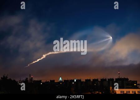 Soyuz space rocket launch. Space jellyfish in sky. Plume of rocket gases in sun at dawn. Jet trail from space rocket. Astronomical phenomenon over cit Stock Photo