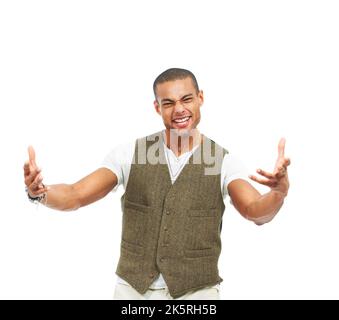 Totally awesome. Extremely enthusiastic trendy young man gesturing to the camera, isolated on white - copyspace. Stock Photo