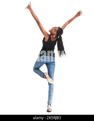 Filled with positive energy and feeling great. Happy young woman posing on a white background while reaching upwards - copyspace. Stock Photo