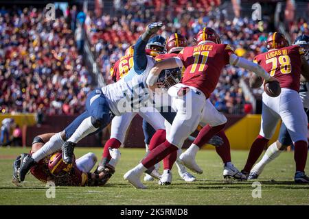 Tennessee Titans defensive tackle Denico Autry wraps up Burrow for