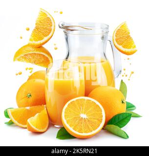 Yellow orange fruits and fresh juice with falling orange slices and orange drops isolated on white background. Stock Photo