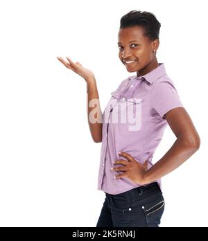Presenting the next big thing. Beautiful young African woman gesturing confidently at copyspace, isolated on white. Stock Photo