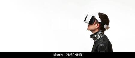 Man is using virtual reality headset. Concept of virtual, augmented and extended reality, metaverse, entertainment and communication. Stock Photo