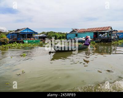 A beautiful landscape of the floating village on Tonle sap lake with a boat Stock Photo