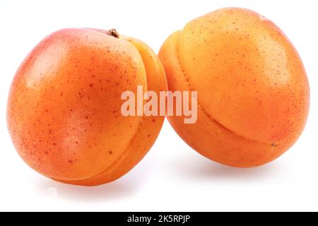 Two ripe apricots isolated on white background. Stock Photo