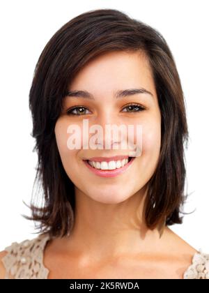 Confident in my future. Closeup of a confident young woman smiling happily, isolated on white. Stock Photo