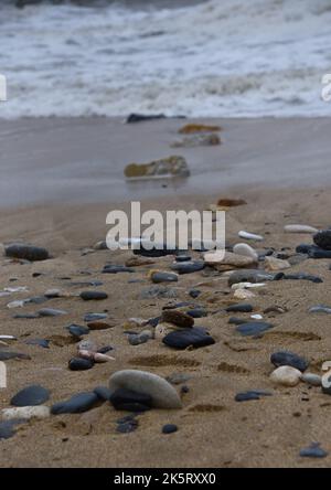 Multi-colored stones on the seashore Stock Photo