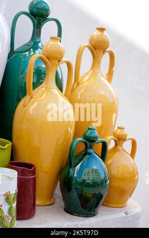 yellow and green vases outside shop in locorotondo, puglia, southern italy Stock Photo