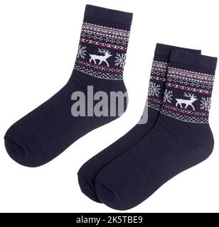 Pair of blue Nordic style socks with Norwegian knitted pattern isolated on a white background Stock Photo