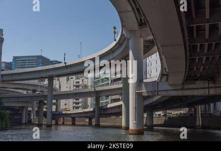 Elevated expressway roads and buildings,, viewed from below, from the Sumida river, Tokyo, Japan. Stock Photo
