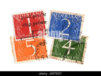 A montage of vintage postage stamps from the Netherlands on a white background. Stock Photo