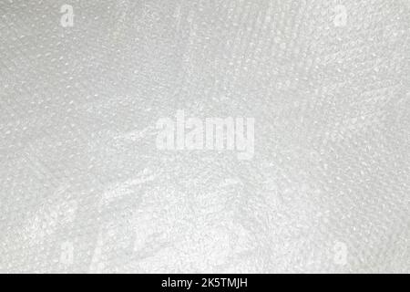 fragment of sheet of plastic transparent bubble pack close-up, texture, background of transparent packaging film Stock Photo