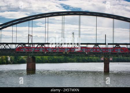 Frankfurt am Main, Germany - Train ride in Frankfurt over old steel bridge Stock Photo