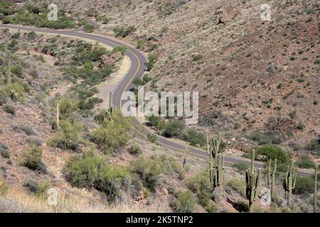 Looking down at a two-lane road making a S Turn in Tonto National Forest Stock Photo