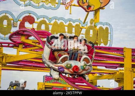 4 Teenagers on highest point, scared in Roller coaster car ride on