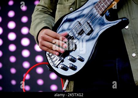 Guitarist bass on stage for background, colorful, soft focus and blur. Stock Photo