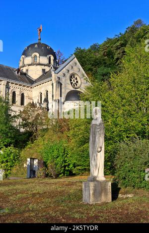 Statue of Joan of Arc (present from Quebec, Canada) outside the basilica of Bois-Chenu (1881-1926) in Domrémy-la-Pucelle (Vosges), France Stock Photo