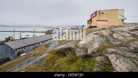 Houses on a Rocky Ridge overlooking the Arctic Ocean and harbor in Iqaluit Stock Photo