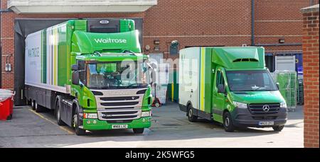 Little and Large Waitrose commercial vehicles at supermarket loading bay van online home orders & hgv lorry truck supply chain store delivery Essex UK Stock Photo