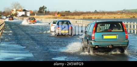 High tide flooding in Blackwater & Colne estuaries covers Strood causeway Essex mainland road link to West Mersea island town & East Mersea village UK Stock Photo